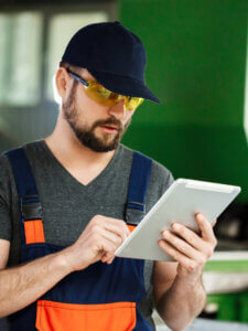 portrait-worker-overalls-steel-factory-background